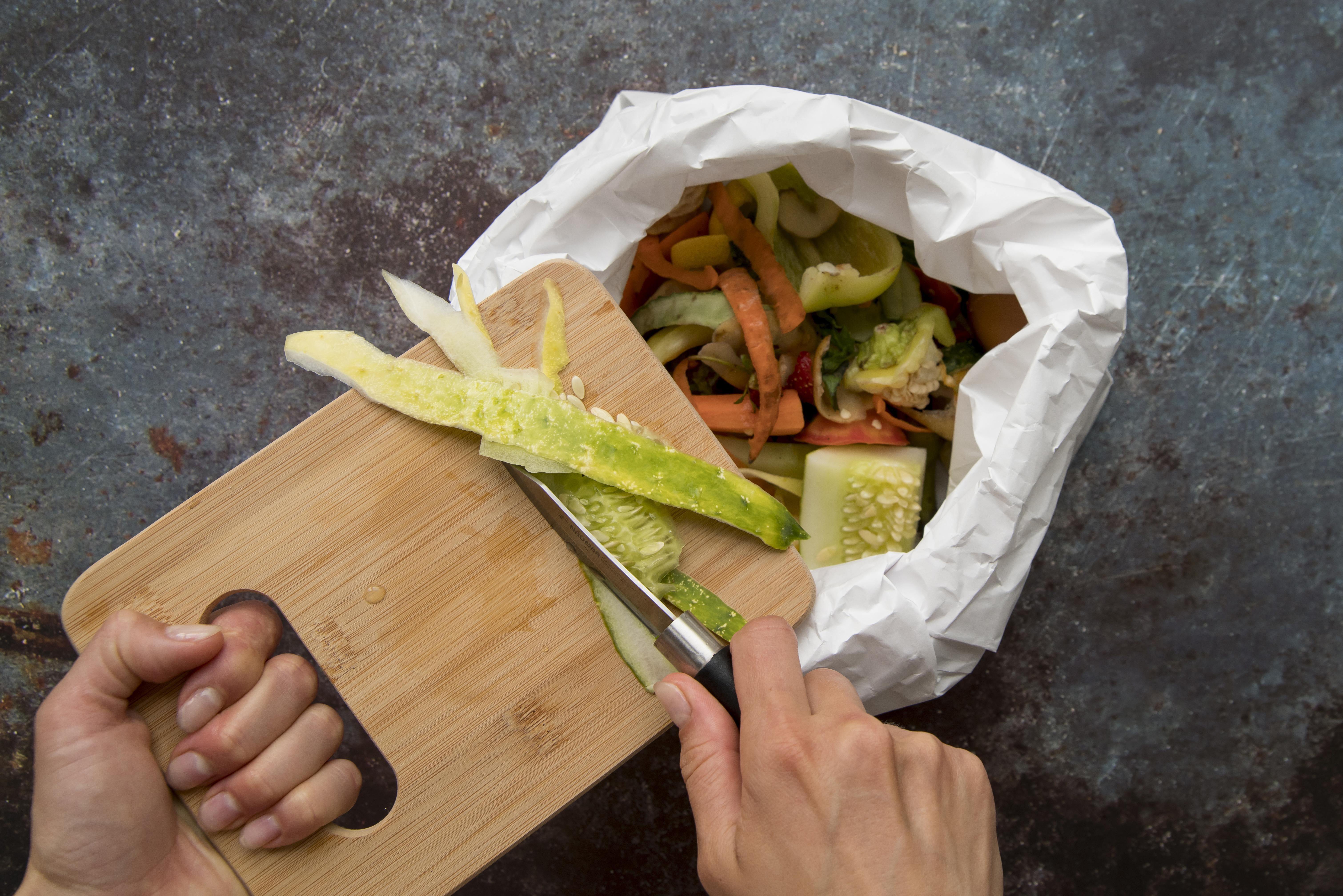 Food waste: discarded fruit and vegetable scraps in a trash bin